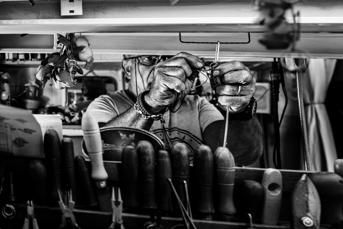 A black and white photo of caftsman in action